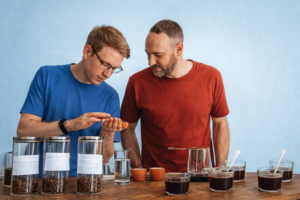 coffee roasters evaluating green coffee beans