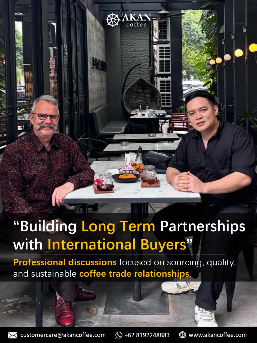 Professional coffee business meeting between AKAN Coffee and international buyer discussing long term coffee trade partnerships.